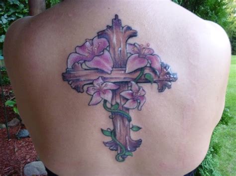 Cross tattoo with lily design