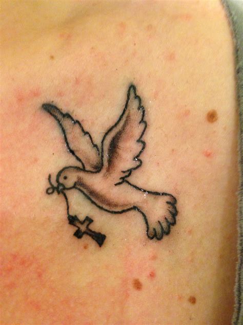 Description of Cross with Dove Tattoo