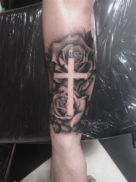 Cross with rose tattoo