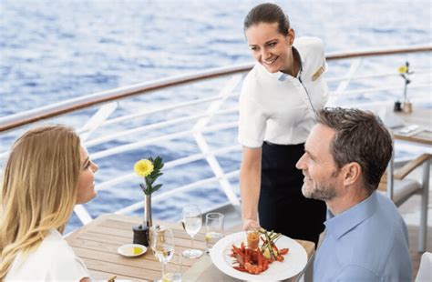 Cruise ship hospitality staff serving passengers