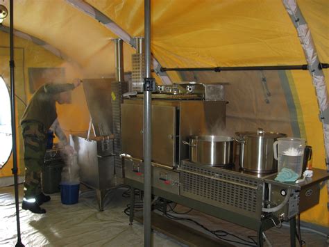 Culinary specialists operate field kitchens to support deployed troops