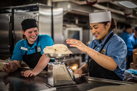 Culinary specialists serving meals