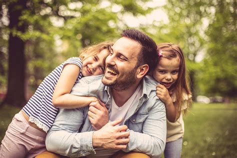 A happy photo of a dad and his family