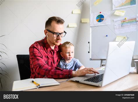 A photo of a dad working in his office