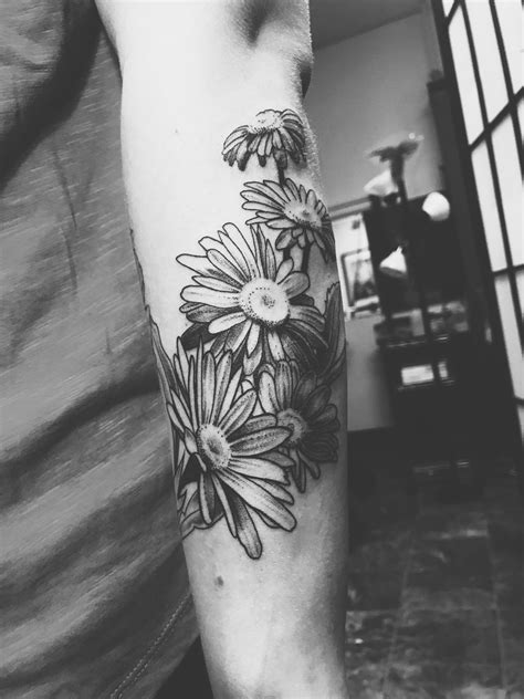 Daisy sleeve tattoo