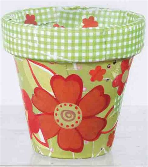 Decoupage flower pot with cut-out images