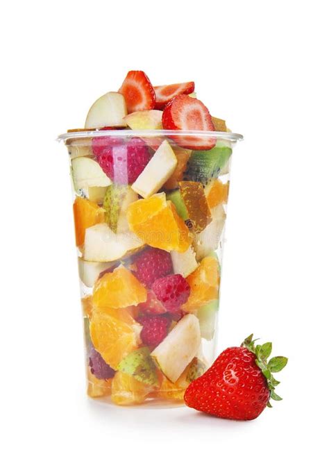 A fruit cup with a variety of fruits and a drizzle of honey