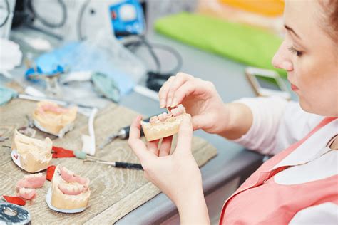 Dental lab technology program students working on a project