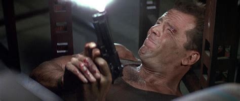 John McClane holding various guns