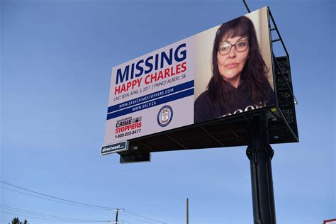 A photo of a digital billboard featuring a missing persons case