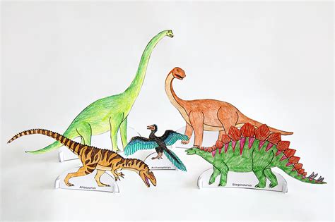 A handmade paper card featuring a dinosaur design