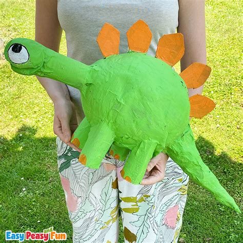 A paper maché dinosaur created using balloons and paper strips