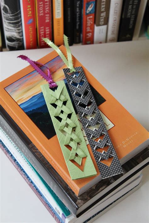 A handmade bookmark with a ribbon and charm