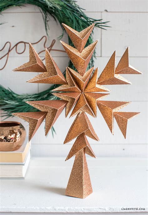 A range of DIY Christmas tree star toppers, including snowflake and angel designs