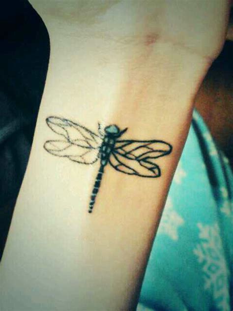 Dragonfly tattoos on wrist