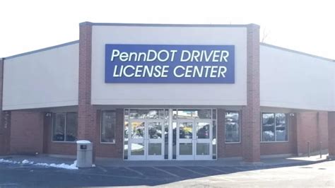 A photo of hours of operation for a Drivers License Center