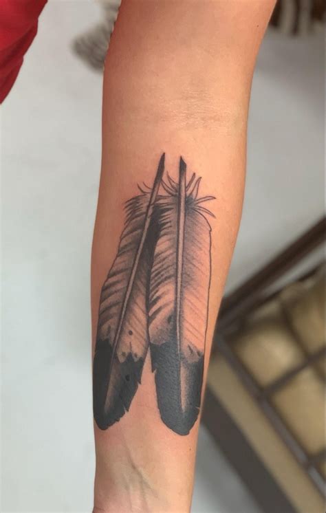 Eagle feather tattoo on the arm