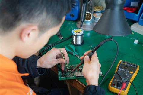 Electrical and electronics repairers at work