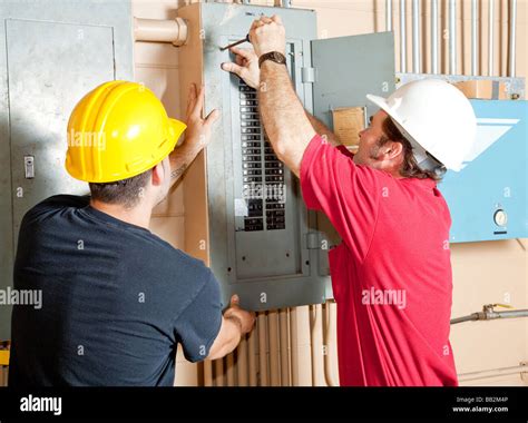 Electricians working together on a project