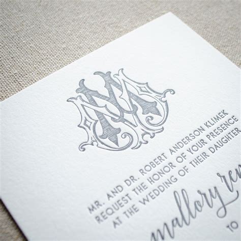 Elegant monogram wedding invitation with gold foil and ribbon