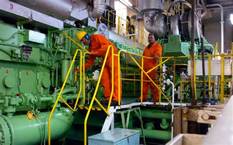 Engine room operations on an aircraft carrier