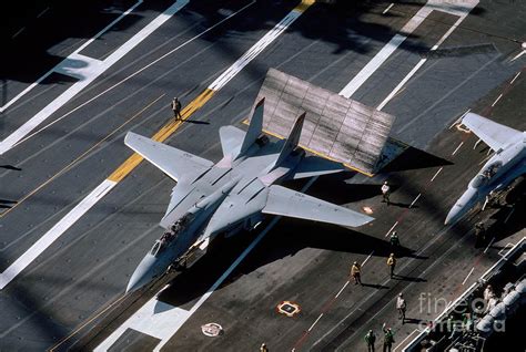 F-14 Tomcat being launched from an aircraft carrier catapult