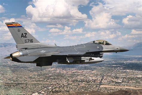 F-16 Fighting Falcon flying low over the desert