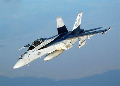 An F-18 Hornet landing on a carrier