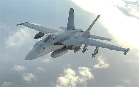 An F-18 Hornet refueling in mid-air