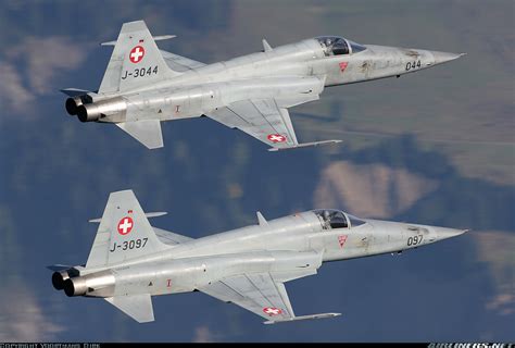 F-5 Tiger II flying in formation with other aircraft, demonstrating its agility and maneuverability