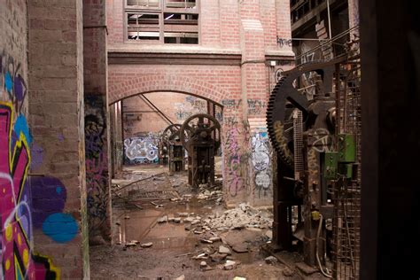 Urban explorer inside an abandoned factory