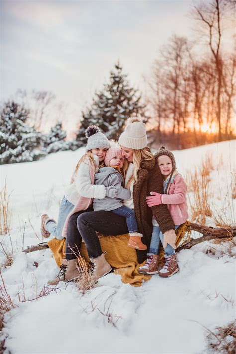 Family playing in the snow for a Christmas portrait