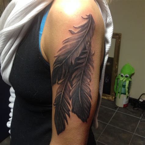 Feather sleeve tattoo on the arm