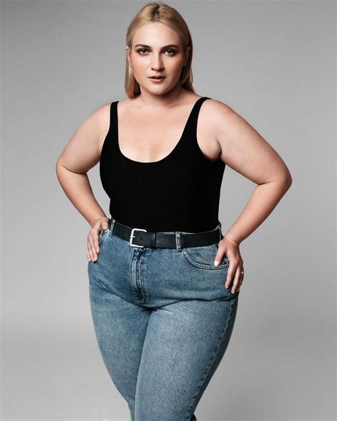 A plus-size female fashion model posing for a photoshoot