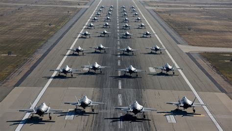 A fighter jet on the runway, preparing for takeoff