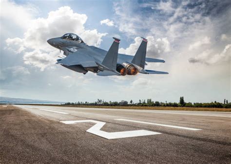 A fighter jet taking off from a runway