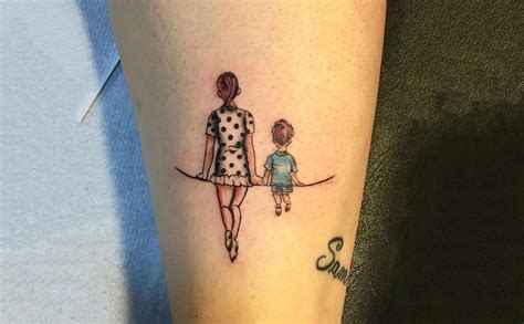 Mother and son with tattoos and smiling