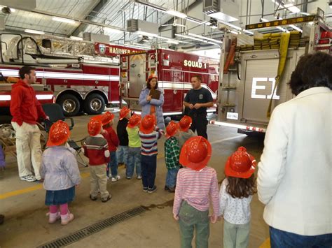 Firefighter teaching fire safety to children