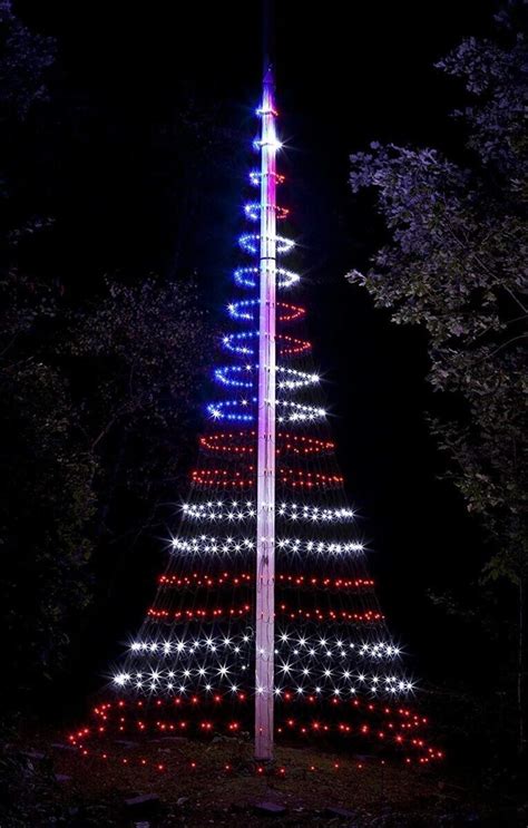 Flag pole wrapped with Christmas tree lights