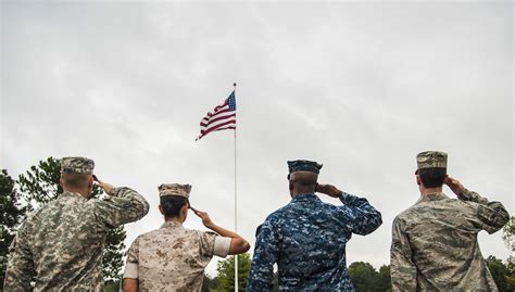 A soldier saluting the flag