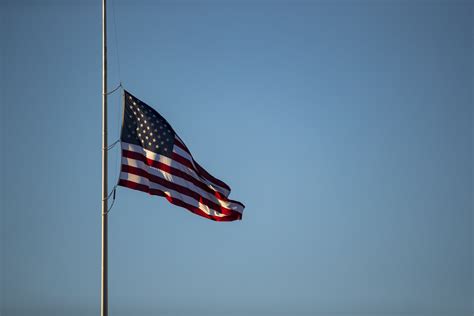 Multiple flags flying at half-mast