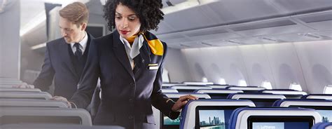 Flight attendant cleaning the cabin