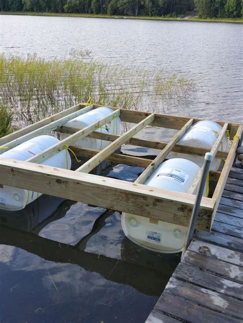 A floating dock with barrels