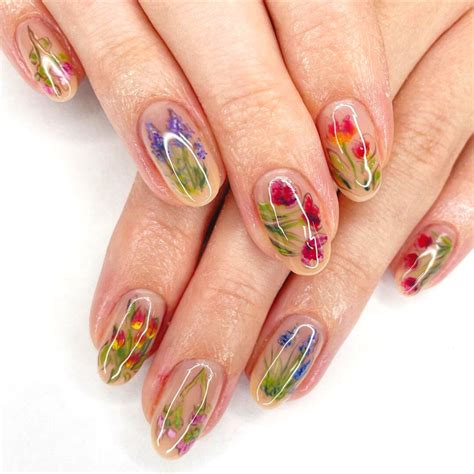 Floral nail art design with intricate flowers and leaves