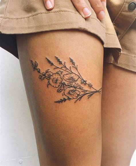 Floral thigh tattoos