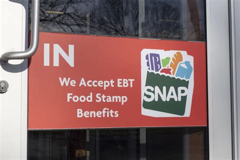 Image of a person reflecting on food stamps