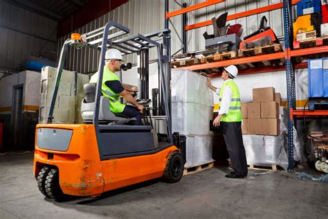 Forklift operator working in a warehouse