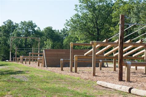 Recruits at Fort Leonard Wood navigating an obstacle course