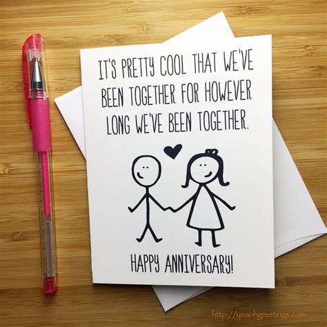 A funny anniversary card with a cartoon couple on a couch