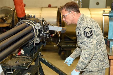 Maintenance personnel inspecting the GAU-8/A Avenger